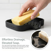MicoYang Silicone Soap Dish with Drain Spout, Self-Draining Sink Organizer Tray for Bathroom and Kitchen, Sponges, Dispensers and Soap Holder, Non-Slip and Dishwasher Safe, Black (Compact, 4.9"×3.2")